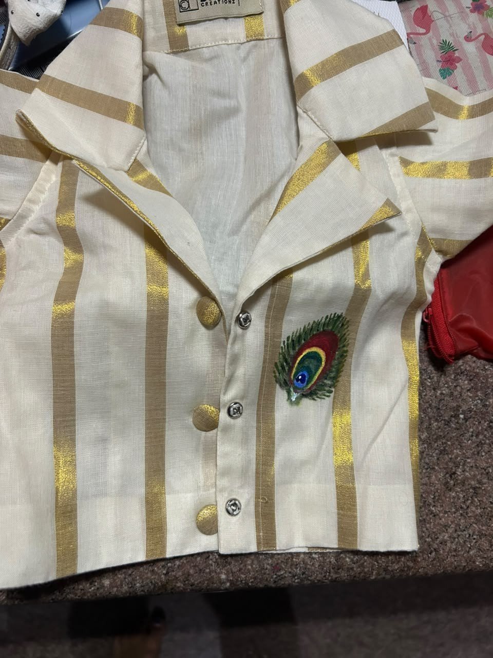 Strip shirt with peacock pattern